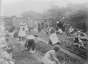 Lady Henry showing T.P. O'Connor over Children's Garden, 1913. Creator: Bain News Service.