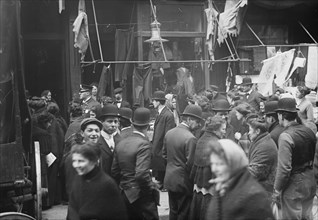 East side crowd discussing price of meat in front of shops, New York, 1910. Creator: Bain News Service.