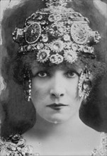 Sarah Bernhardt with elaborate headdress, 1912. Creator: Bain News Service.