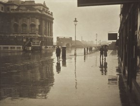 A wet day in Wellington Street. From the album: Photograph album - London, 1920s. Creator: Harry Moult.