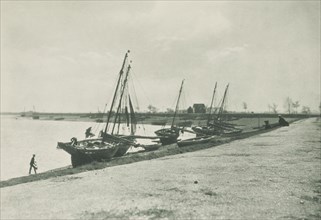 [Boats on beach]. From the album: Photograph album - England, 1920s. Creator: Harry Moult.