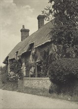 Thatched cottage. From the album: Photograph album - England, 1920s. Creator: Harry Moult.