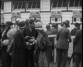 A Crowd of People Standing Outside a Totaliser/Tote Office at a Horse Race Course..., 1929. Creator: British Pathe Ltd.