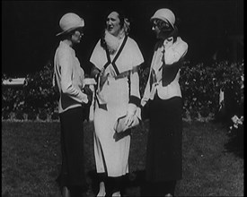 A Group of Three Female Civilians Wearing Fashionable Clothes Standing in a Garden, 1929. Creator: British Pathe Ltd.