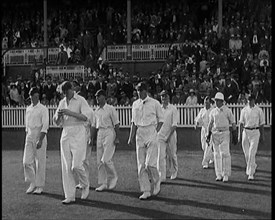 The English Cricket Team Coming Out to Play in Ashes Test in Front of a Large Crowd, 1929. Creator: British Pathe Ltd.