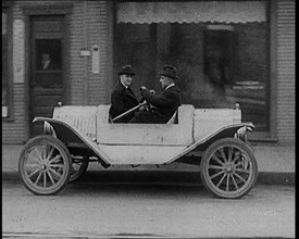 Male Civilians Test Driving the Two Way Car Which Has Two Steering Wheels and Can Be Driven..., 1929 Creator: British Pathe Ltd.