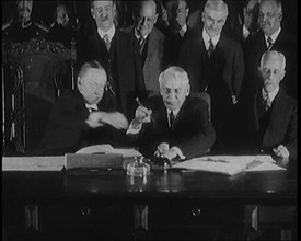 Frank Billings Kellogg Sitting Next to American President Calvin Coolidge Signing the Kellogg...1929 Creator: British Pathe Ltd.