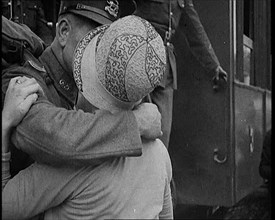 Male Soldier Kissing Female Civilian before boarding a Train, 1929. Creator: British Pathe Ltd.