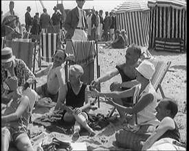 Civilians Enjoying a Sunny day on a Very Crowded Beach, 1920. Creator: British Pathe Ltd.