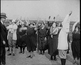 A Group of Plus Size Female Civilians Exercising on a Beach, 1920. Creator: British Pathe Ltd.