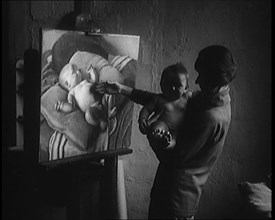 A Female Civilian Holding a Nude Child in Her Arms in front of a Painting of a Nude Child, 1920. Creator: British Pathe Ltd.