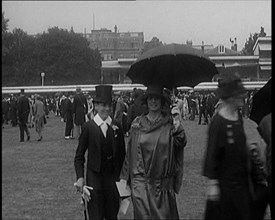 A Group of Civilians Dressed Glamorously Walking on the Grounds of a Cricket Match, 1920. Creator: British Pathe Ltd.