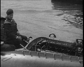 Marion Barbara 'Joe' Carstairs on a Speedboat with a Male Civilian Passenger, 1920. Creator: British Pathe Ltd.