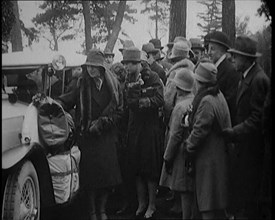 Two Female Civilians Wearing Heavy Coats and Hats Embarquing a Luggage Loaded Car Watched by...,1920 Creator: British Pathe Ltd.