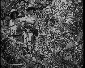 Two Female Civilians Wearing Explorers Outfit Observing Nature in the Jungle, 1920. Creator: British Pathe Ltd.
