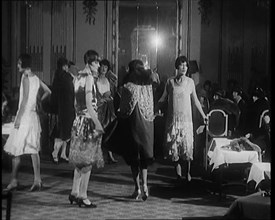 A Group of Female Civilians Modelling Various Glamorous Outfits in a Fashion Parade, 1920. Creator: British Pathe Ltd.