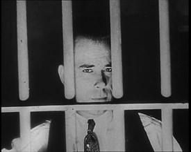 American Gangster John Dillinger Behind Bars, 1930s. Creator: British Pathe Ltd.