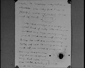 Notes of Ransom Being Shown as Articles of Evidence in the Lindbergh's Kidnapping Case Trial, 1930s. Creator: British Pathe Ltd.