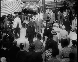 Crowd of Well Dressed People Walking Down the Pavement, 1933. Creator: British Pathe Ltd.