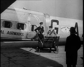 Three Men Tending to a Plane on the Ground, 1933. Creator: British Pathe Ltd.