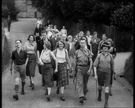 People Hiking Down a Road Towards the Camera, 1933. Creator: British Pathe Ltd.
