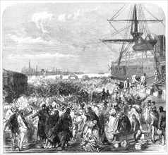 Embarkation of dockyard workmen as emigrants at Portsmouth, 1869. Creator: Unknown.