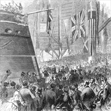 Launch of the screw-corvette Druid, Deptford Dockyard: Princess Louise releasing the dog-shore, 1869 Creator: Unknown.