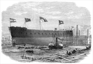 Launch of the Victoria, iron-clad frigate built for the Queen of Spain at Blackwall, 1865. Creator: Smyth.