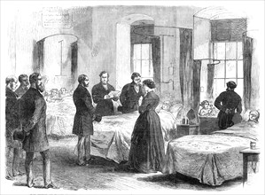 The Prince of Wales visiting persons at St. Bart's Hospital wounded by Clerkenwell Explosion, 1868. Creator: Unknown.