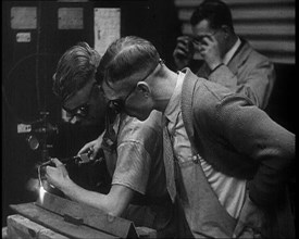 Man Inspecting an other Man Working With a Blowtorch, 1933. Creator: British Pathe Ltd.