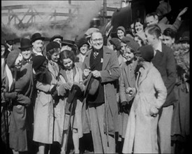 People Standing at  a Train Station, 1933. Creator: British Pathe Ltd.