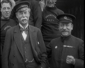 Sir Thomas Lipton Standing With the Crew of the Ship 'The Shamrock', 1920. Creator: British Pathe Ltd.