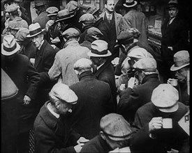 Small Crowd of Men Standing Outside in a Crowded Space, 1933. Creator: British Pathe Ltd.