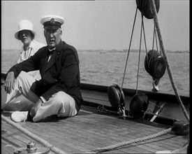 A Man and a Woman Sitting on the Deck of a Yacht at  Cowes, 1933. Creator: British Pathe Ltd.