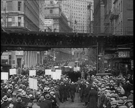 Crowd Walking Parading Down a Road and Holding Signs, 1933. Creator: British Pathe Ltd.