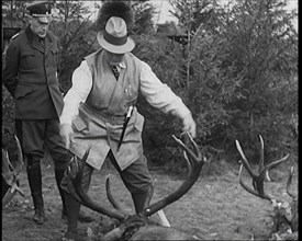 Nazi Officer Hermann Goering in Hunting Dress Showing His Colleagues a Line of Deer He..., 1931. Creator: British Pathe Ltd.