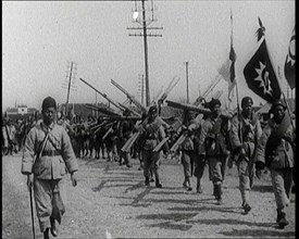 Chinese Soldiers Marching Carrying Flags and Other Equipment, 1920s. Creator: British Pathe Ltd.