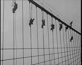 Men Painting the Brooklyn Bridge in New York City, 1922. Creator: British Pathe Ltd.