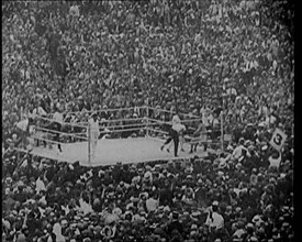 View of the Boxing Ring at a Crowded Sports Stadium for a Match Between George Carpentier..., 1921. Creator: British Pathe Ltd.