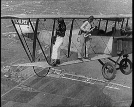 Jazz Musicians Playing from the Wing of a Biplane in the Air, 1921. Creator: British Pathe Ltd.