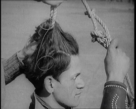 Native American Man Having a Rope Tied Into His Hair, 1921. Creator: British Pathe Ltd.