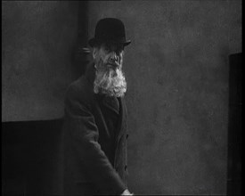 A Man Sporting a Beaver Beard Walking Along a Street, 1922. Creator: British Pathe Ltd.