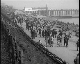 A Crowd of Civilians Sitting on Deckchairs at the Beach, 1926. Creator: British Pathe Ltd.