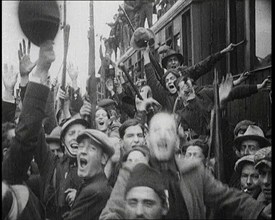 Italian Soldiers Standing on or Near a Train, Waving and Cheering, 1922. Creator: British Pathe Ltd.