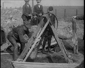 Miners Retrieving Coal from a Shallow Surface Mine, 1921. Creator: British Pathe Ltd.