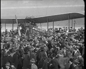 A Large Group of People Crowding Around Sir Alan Cobham's Aeroplane Greeting Him on His..., 1926. Creator: British Pathe Ltd.