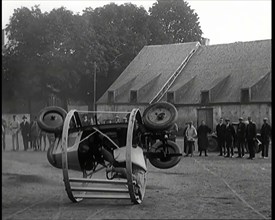 A Crashable Car With a Circular Frame Allowing It To Roll Over Being Tested in Front of..., 1926. Creator: British Pathe Ltd.