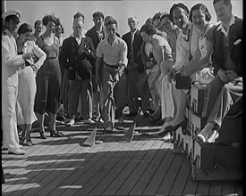 People Enjoying Games on Deck of a Cruise Liner Whilst at Sea, 1931. Creator: British Pathe Ltd.