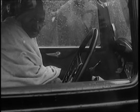 Mohandas K Gandhi (Mahatma) Sitting in a Car in the Rain, 1931. Creator: British Pathe Ltd.