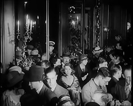 A Crowd of People Filing Into the Foyer of a Theatre, 1931. Creator: British Pathe Ltd.